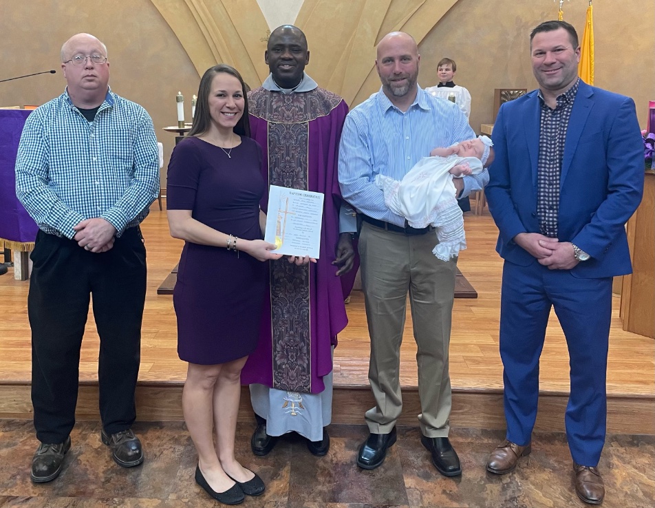 Fr. John Igwe, CM, celebrates our latest parish baptism